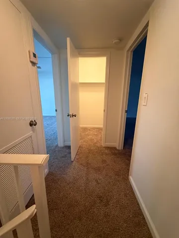 a view of a room with a furniture