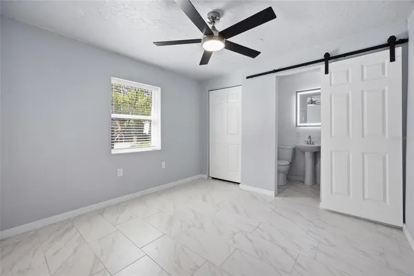 a view of an empty room with a window