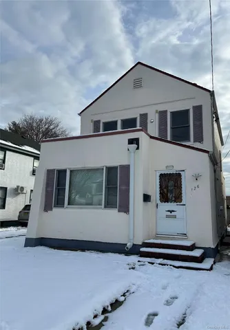 a front view of a house with a garage