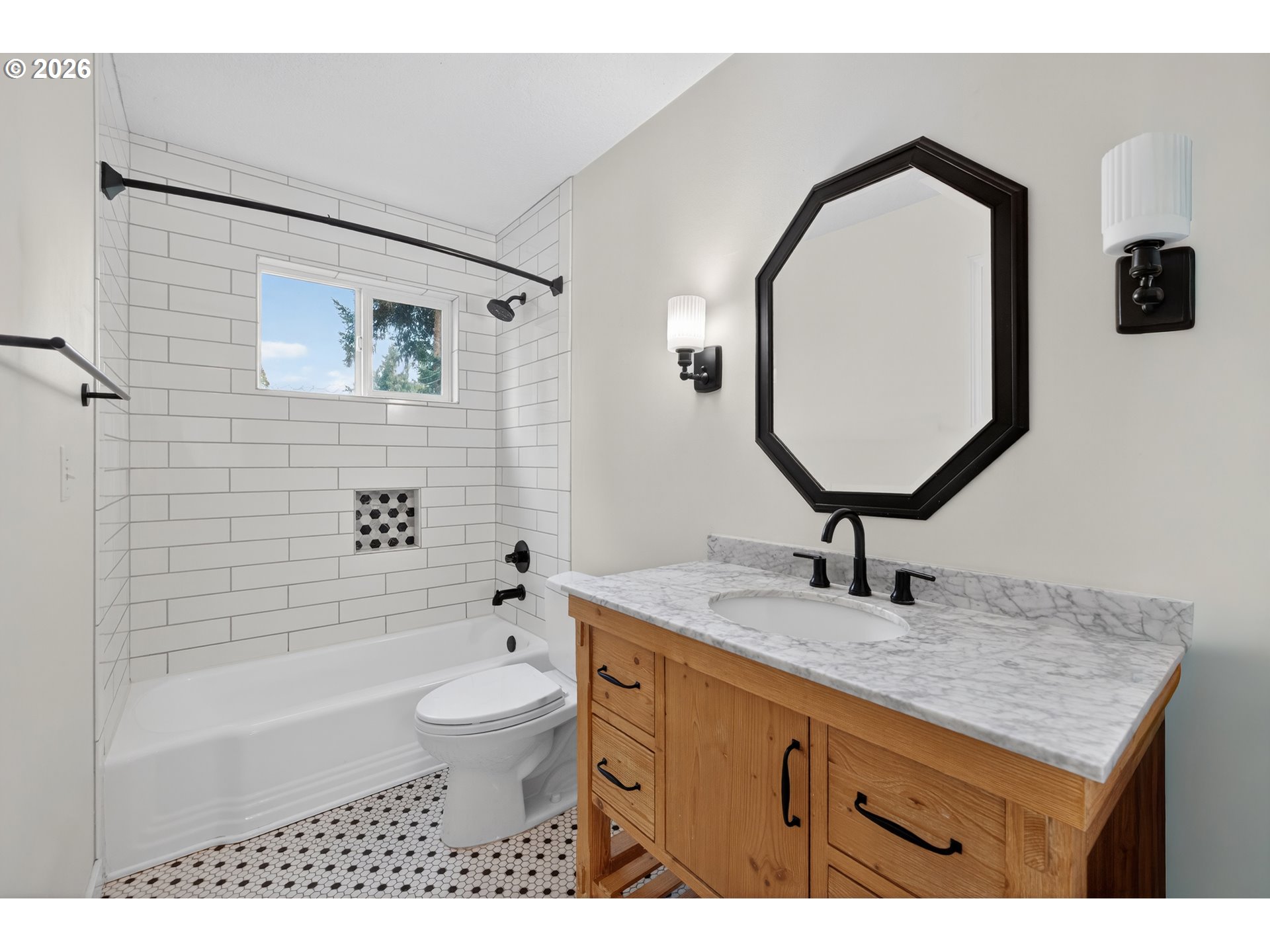 7450 Southwest 101st Avenue Beaverton, OR 97008 - Photo 23 of 37 a bathroom with a granite countertop toilet a sink and mirror