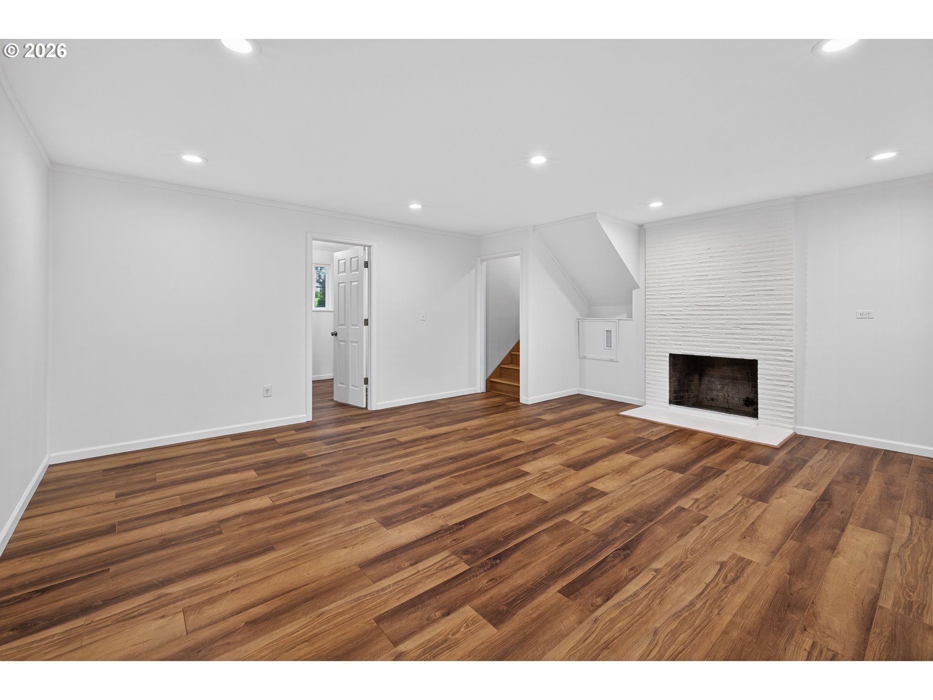 7450 Southwest 101st Avenue Beaverton, OR 97008 - Photo 25 of 37 a big room with wooden floor and a bed