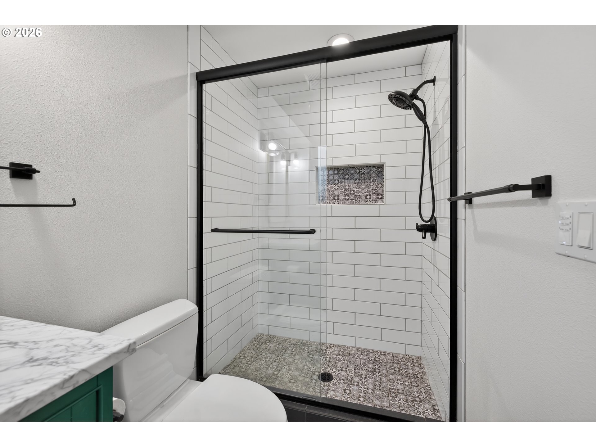 7450 Southwest 101st Avenue Beaverton, OR 97008 - Photo 29 of 37 a bathroom with a shower and a sink