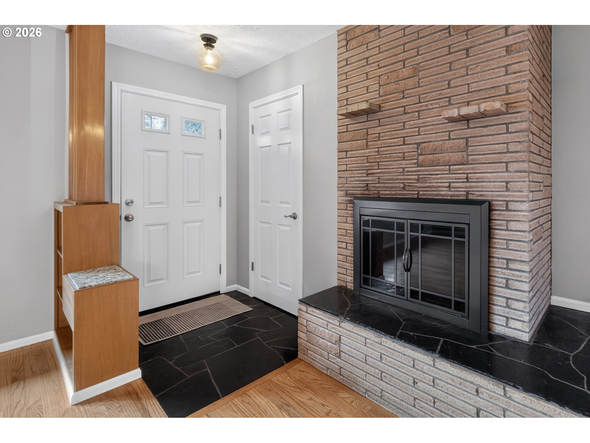 7450 Southwest 101st Avenue Beaverton, OR 97008 - Photo 5 of 37 a living room with furniture and a fireplace