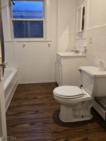 a bathroom with a toilet and a sink
