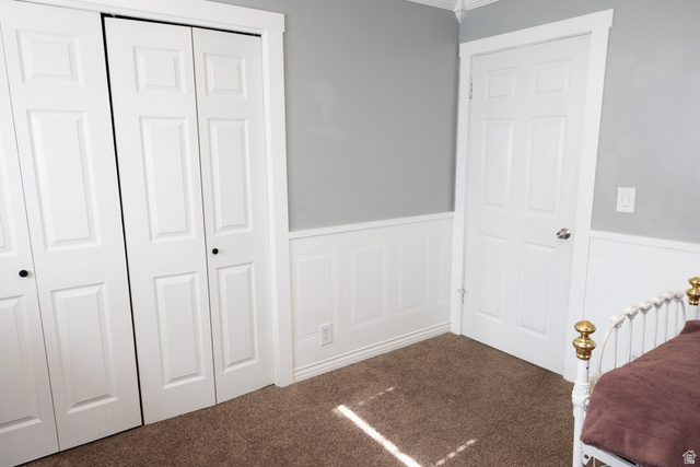 827 South 600 East Logan, UT 84321 - Photo 18 of 30 Room featuring light gray walls, white wainscoting, and brown carpet flooring
