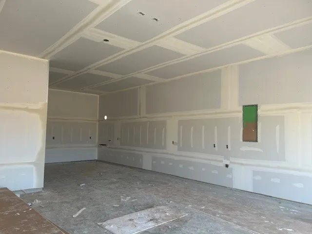 a living room with furniture and windows