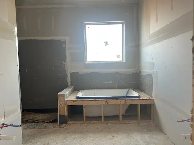 a room with a lot of cabinets and wooden floors