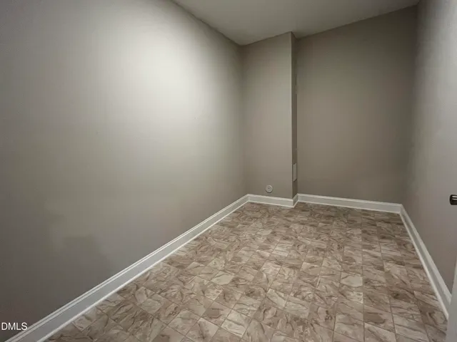 a bathroom with a sink a toilet a mirror and shower