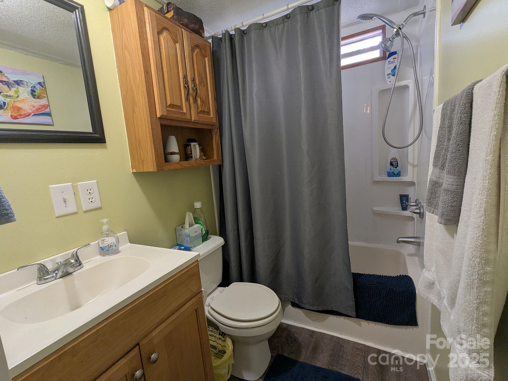 104 Little River Road Fort Mill, SC 29707 - Photo 13 of 21 a bathroom with a sink a toilet and shower