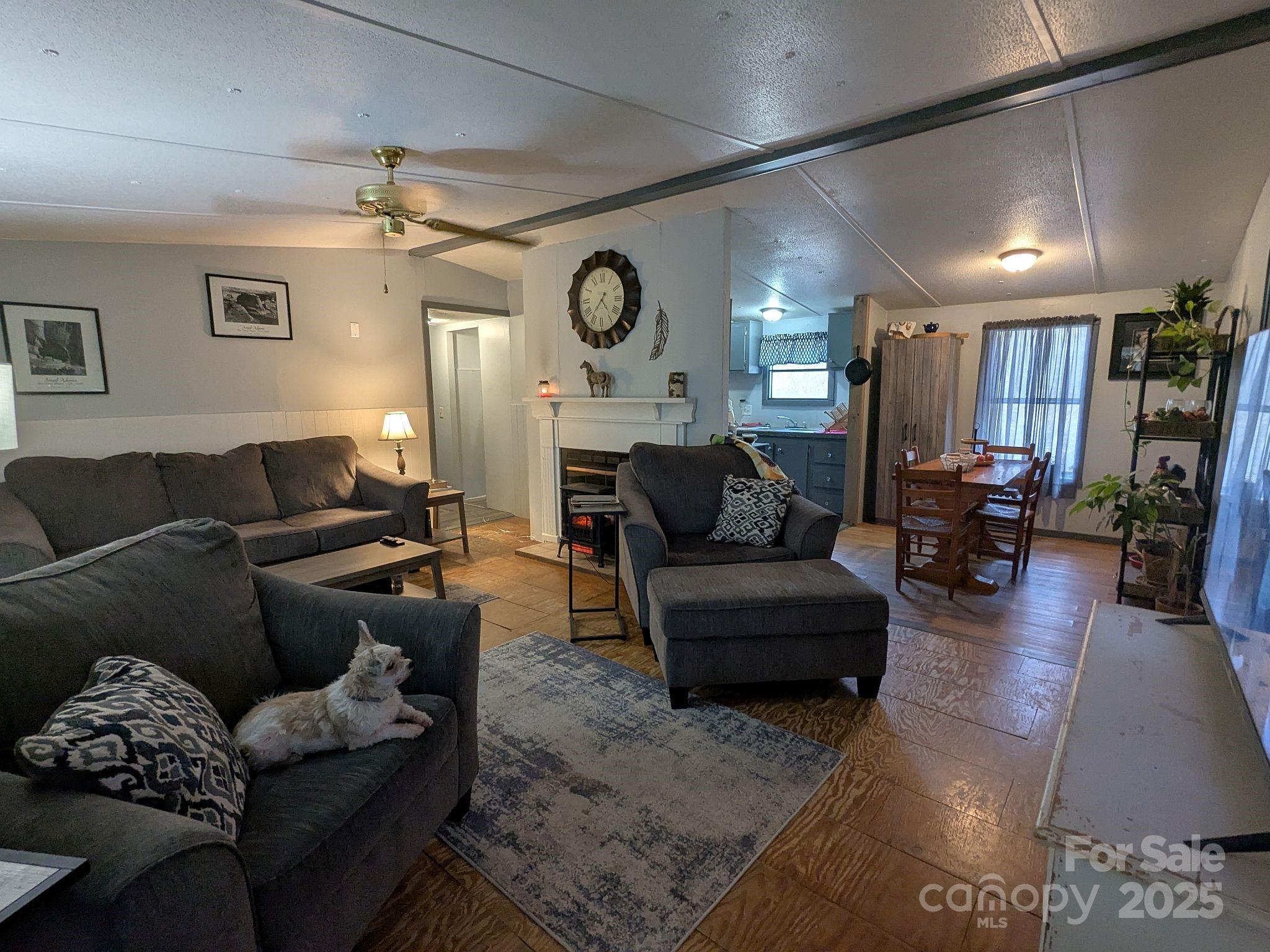 104 Little River Road Fort Mill, SC 29707 - Photo 4 of 21 a living room with furniture and a wooden floor