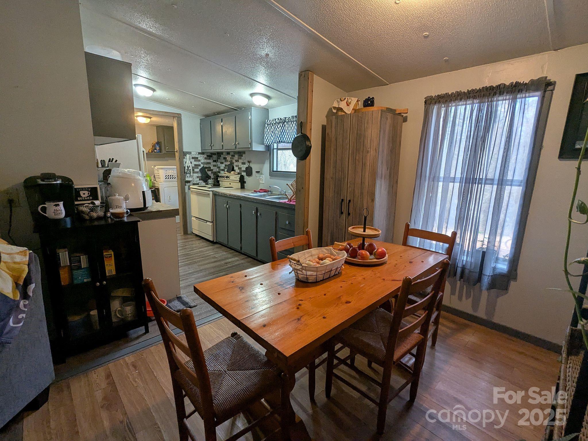 104 Little River Road Fort Mill, SC 29707 - Photo 8 of 21 a view of a dining room with furniture and wooden floor