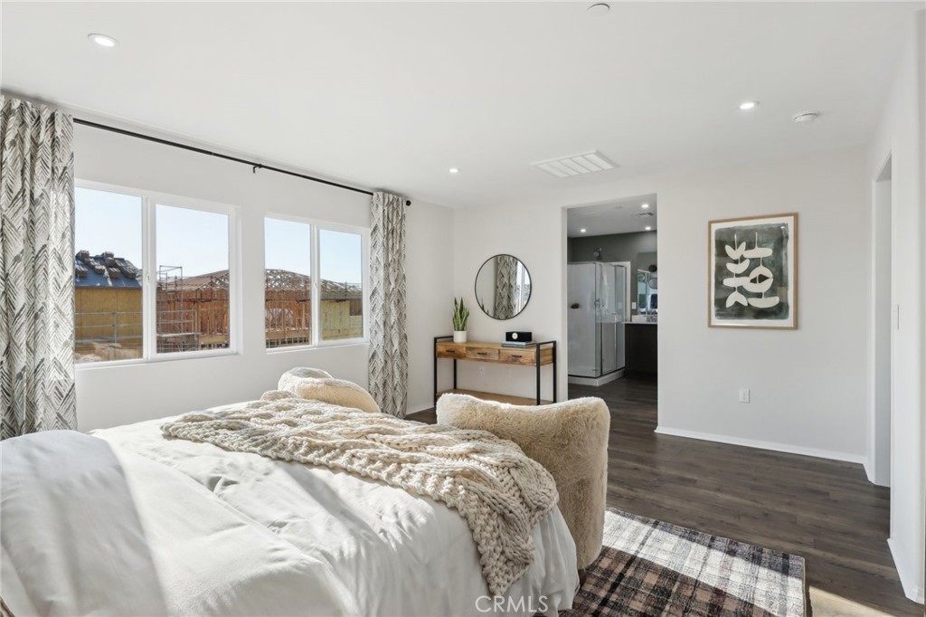 49459 Meadowlark Place Indio, CA 92201 - Photo 25 of 33 a bedroom with a large bed and a large window