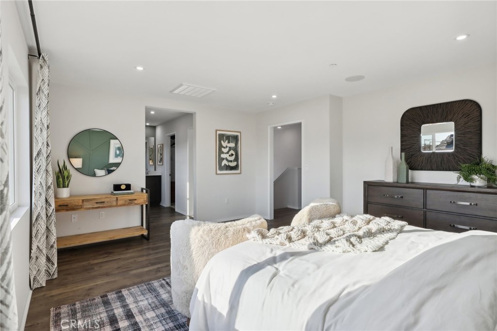 49459 Meadowlark Place Indio, CA 92201 - Photo 26 of 33 a bedroom with a bed and a mirror on dresser