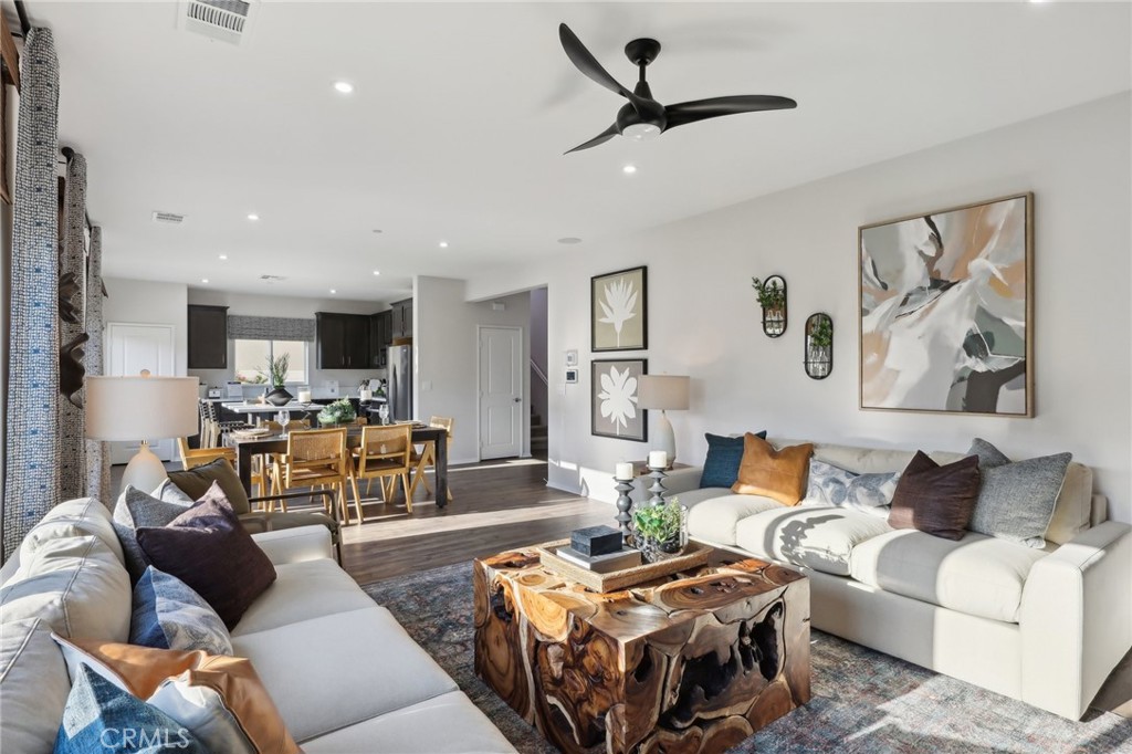 49459 Meadowlark Place Indio, CA 92201 - Photo 4 of 33 a living room with furniture and a view of kitchen