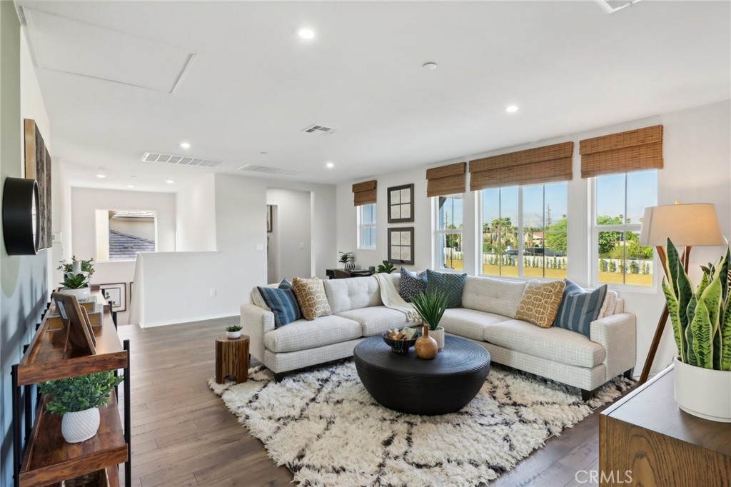 49459 Meadowlark Place Indio, CA 92201 - Photo 8 of 33 a living room with furniture and a large window