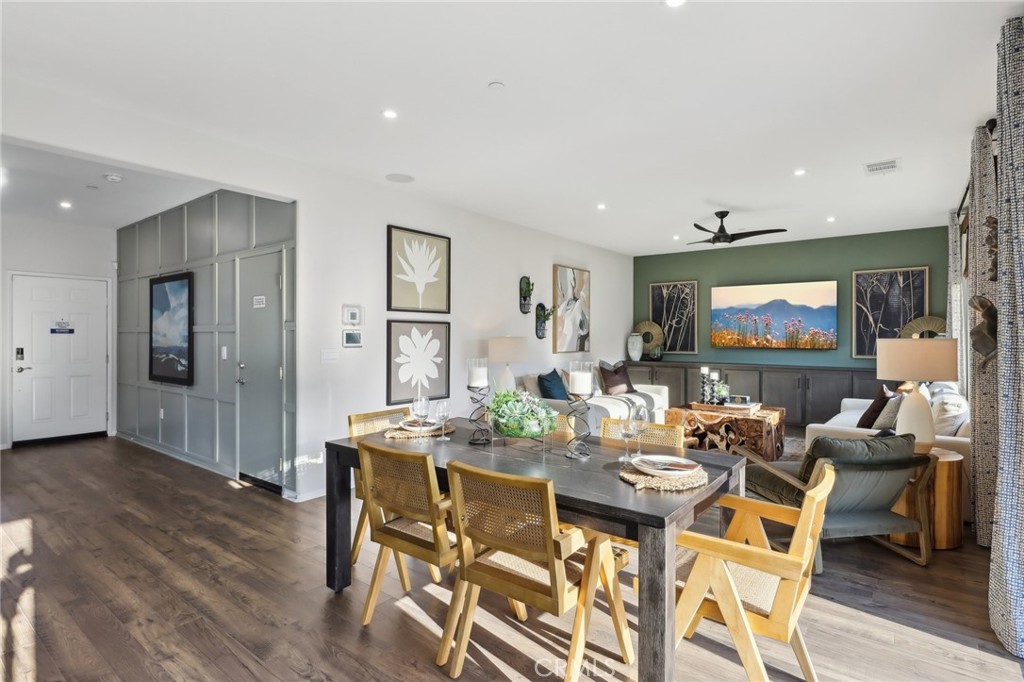 49459 Meadowlark Place Indio, CA 92201 - Photo 10 of 33 a view of a dining room with furniture and wooden floor