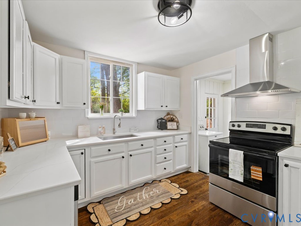 4803 Morrison Road Richmond, VA 23230 - Photo 14 of 45 a kitchen with stainless steel appliances a stove a sink and a refrigerator