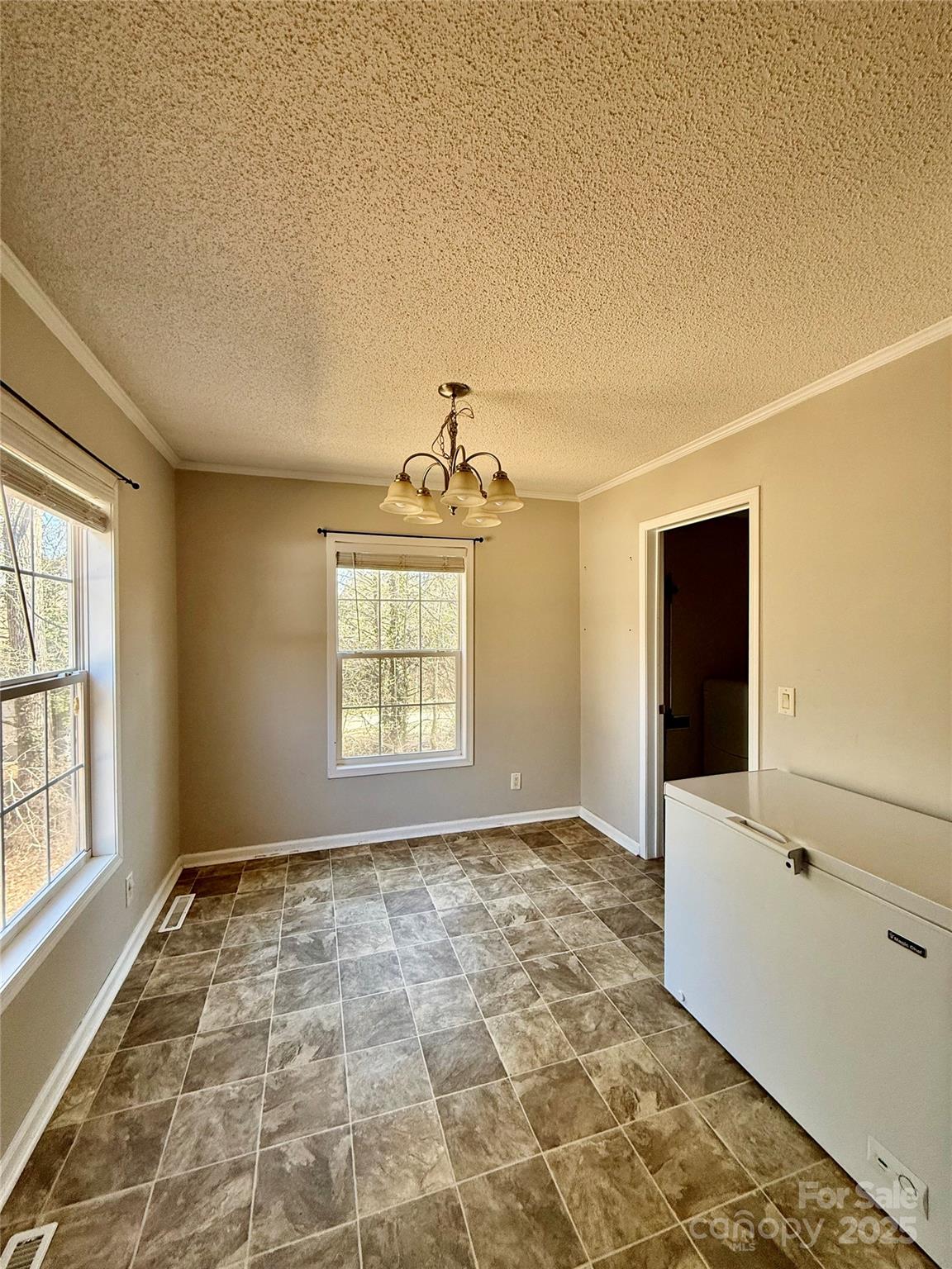191 Ashford Drive Olin, NC 28660 - Photo 11 of 48 a view of an empty room and window