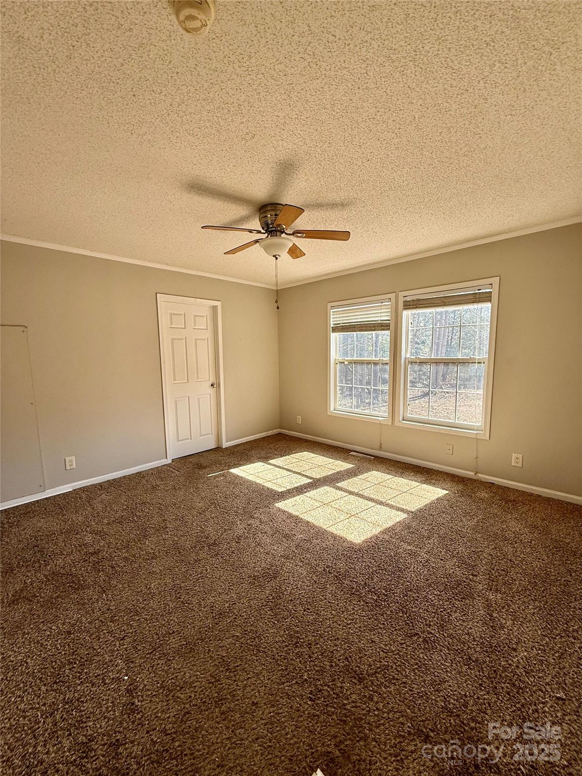 191 Ashford Drive Olin, NC 28660 - Photo 13 of 48 an empty room with a empty space and windows