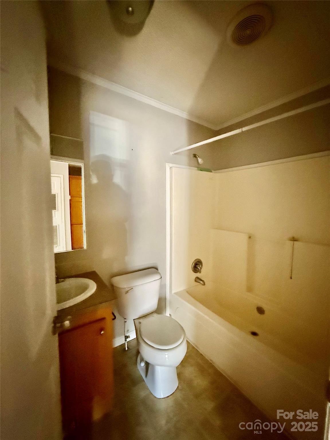 191 Ashford Drive Olin, NC 28660 - Photo 20 of 48 a white toilet sitting next to a bathroom sink and a shower