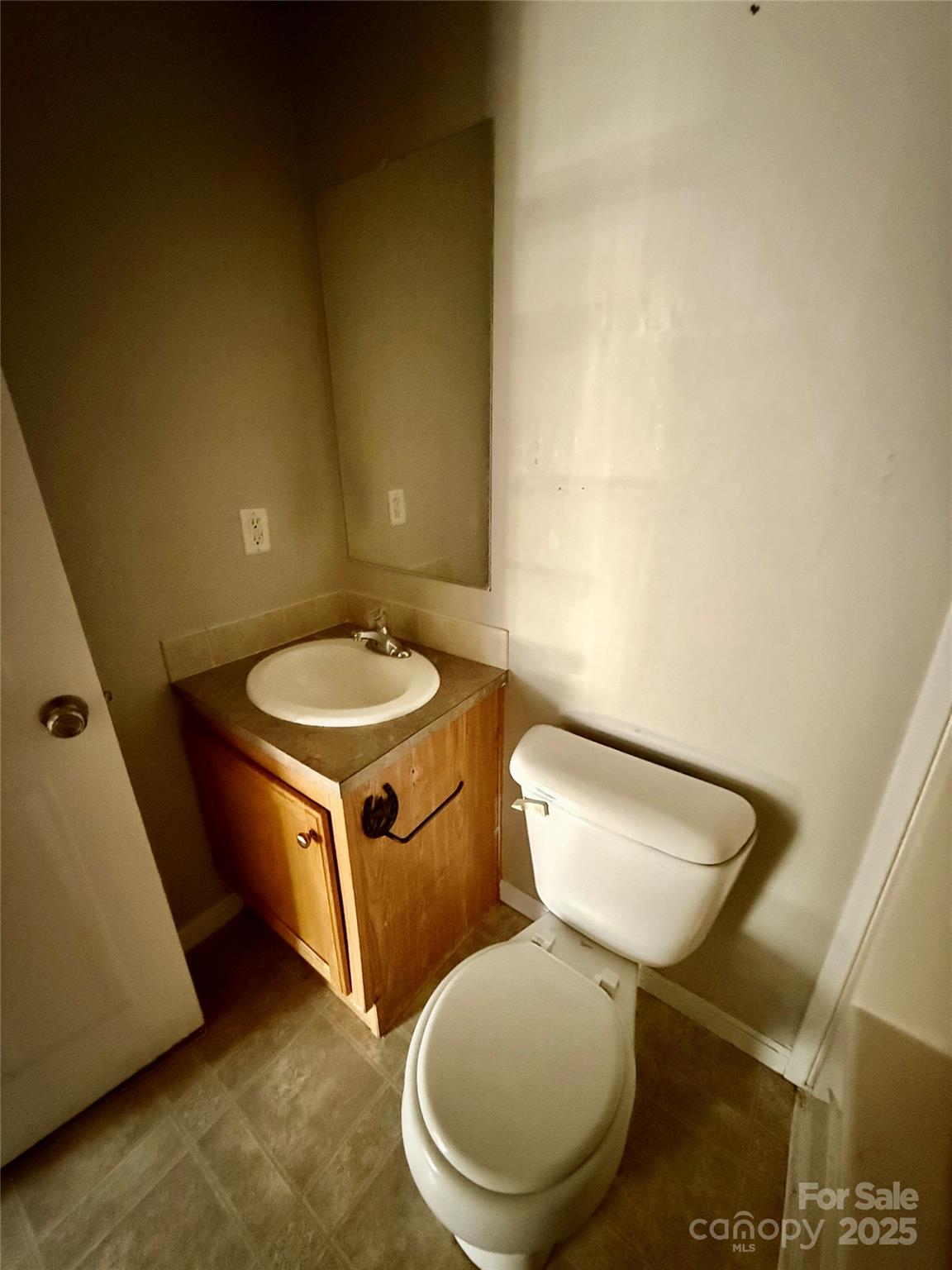 191 Ashford Drive Olin, NC 28660 - Photo 21 of 48 a bathroom with a toilet and a mirror