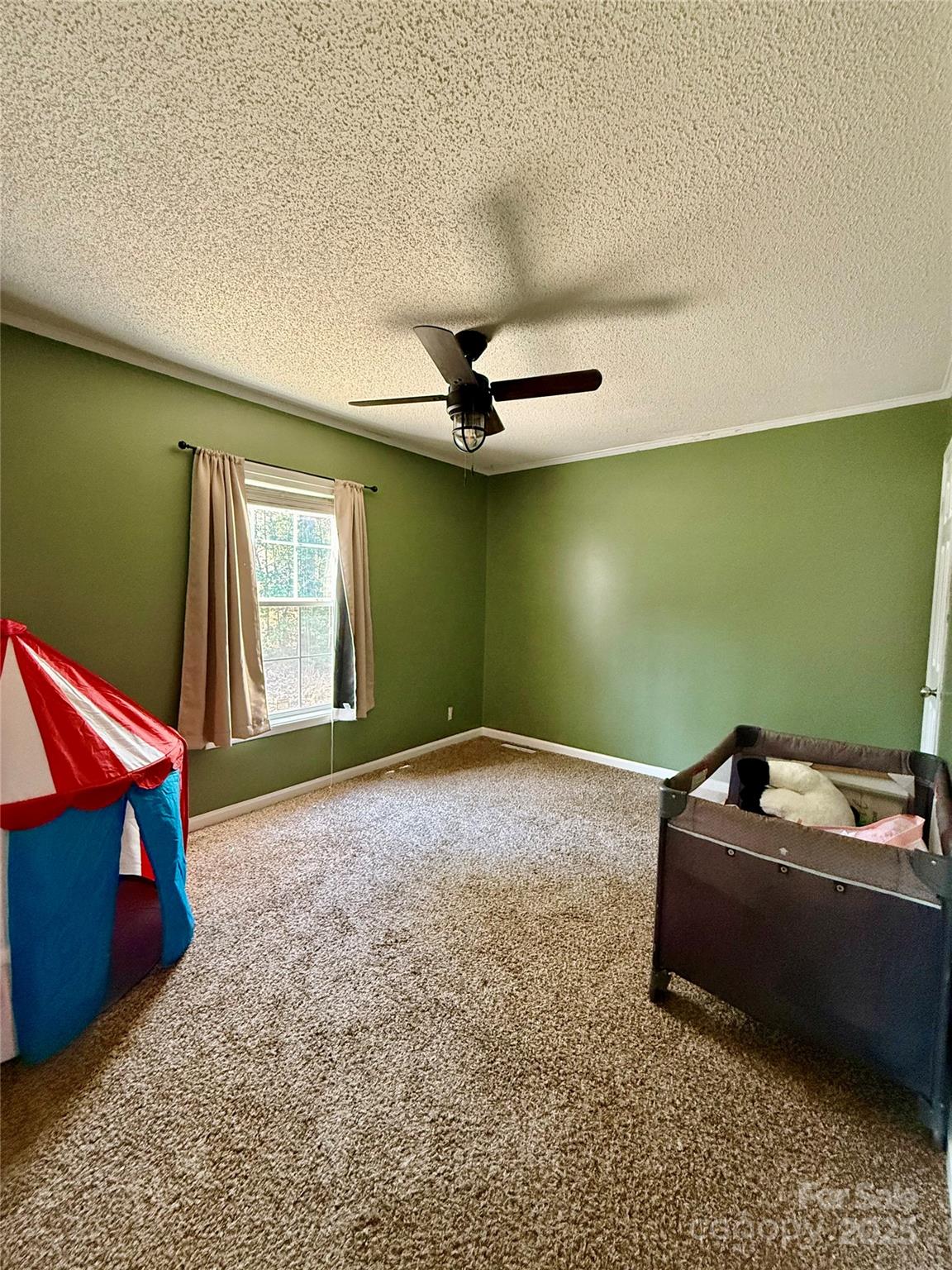 191 Ashford Drive Olin, NC 28660 - Photo 25 of 48 a room with a window and a table