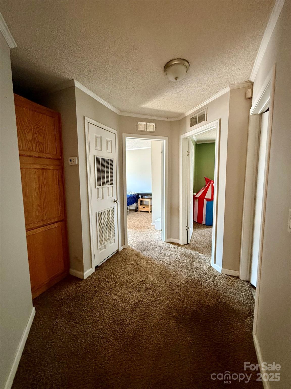 191 Ashford Drive Olin, NC 28660 - Photo 27 of 48 a view of a livingroom with wooden floor and a refrigerator