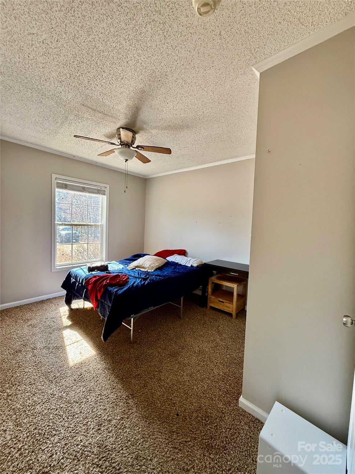 191 Ashford Drive Olin, NC 28660 - Photo 28 of 48 a bedroom with a bed and a window