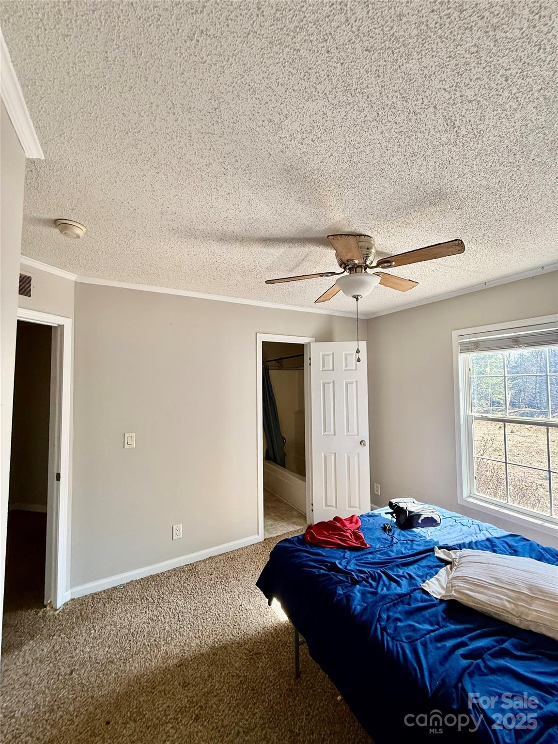 191 Ashford Drive Olin, NC 28660 - Photo 29 of 48 a bedroom with a bed and a window