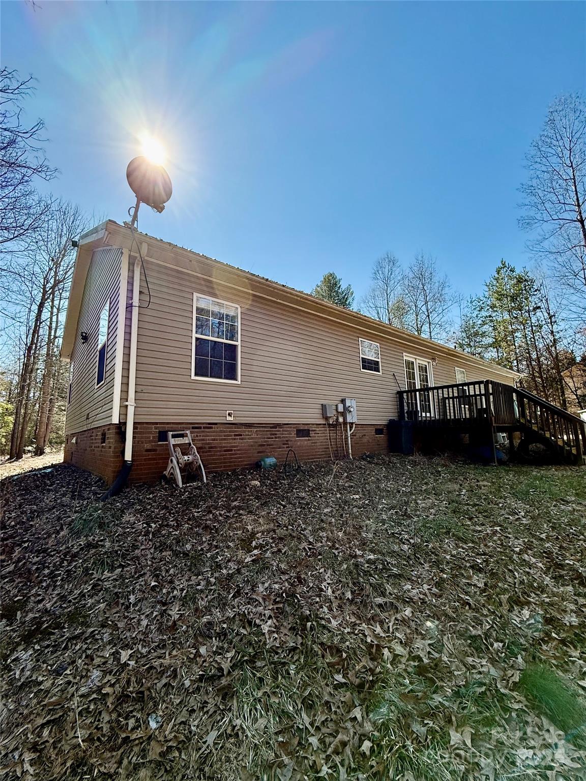 191 Ashford Drive Olin, NC 28660 - Photo 32 of 48 a house view with a backyard space