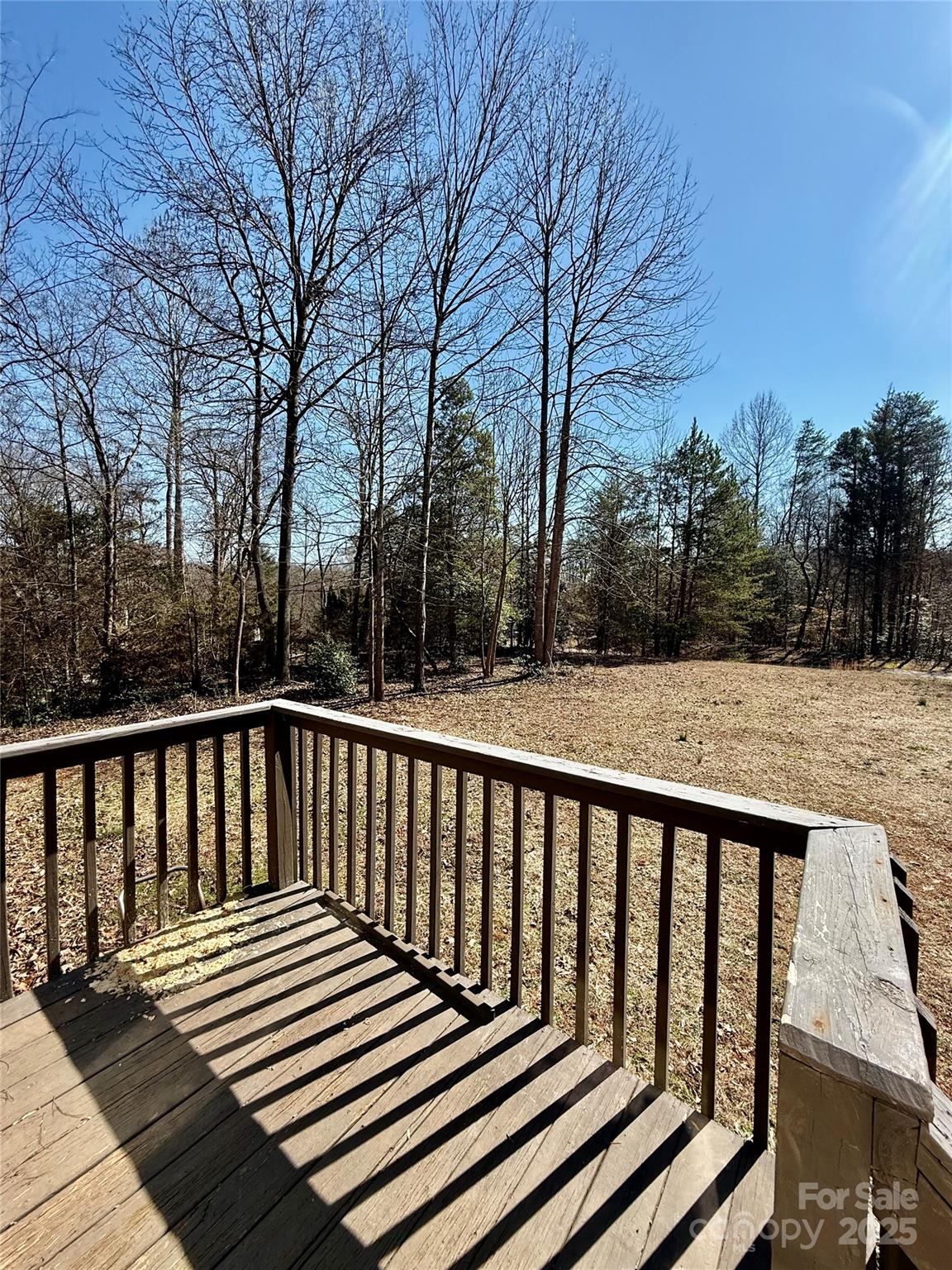 191 Ashford Drive Olin, NC 28660 - Photo 35 of 48 a view of balcony with wooden floor and fence