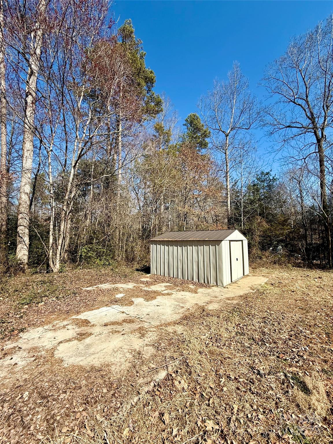 191 Ashford Drive Olin, NC 28660 - Photo 41 of 48 a view of a yard with wooden fence