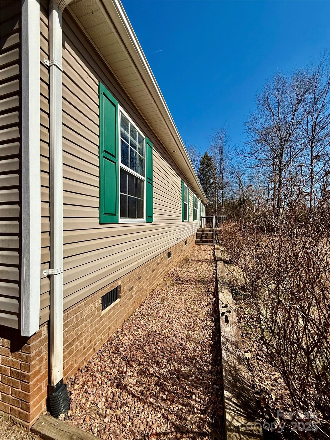191 Ashford Drive Olin, NC 28660 - Photo 5 of 48 a view of a house with a backyard