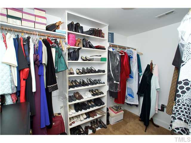 7309 Mevan Court Raleigh, NC 27613 - Photo 14 of 22 a view of walk in closet with clothes and shoes