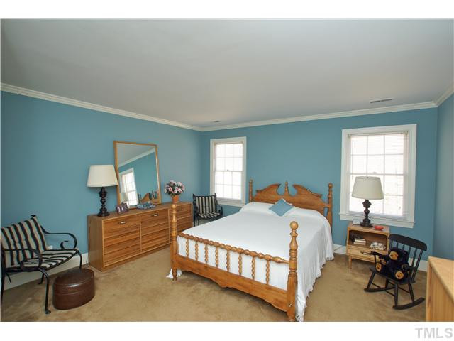 7309 Mevan Court Raleigh, NC 27613 - Photo 18 of 22 a bedroom with two beds and dresser