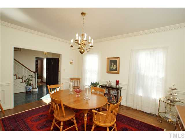 7309 Mevan Court Raleigh, NC 27613 - Photo 3 of 22 a view of a dining room with furniture and wooden floor