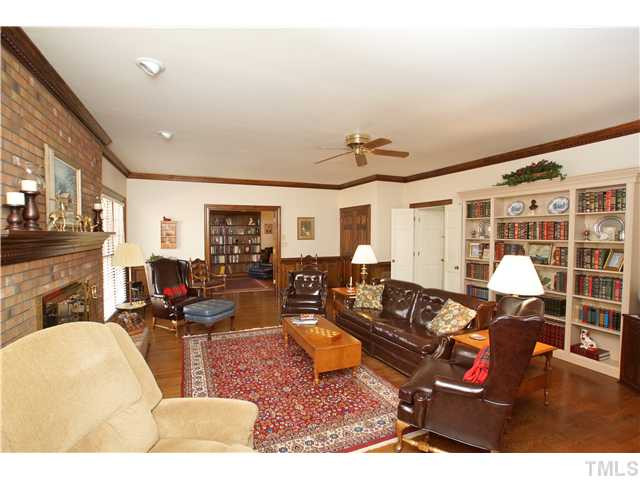7309 Mevan Court Raleigh, NC 27613 - Photo 4 of 22 a living room with furniture window and wooden floor