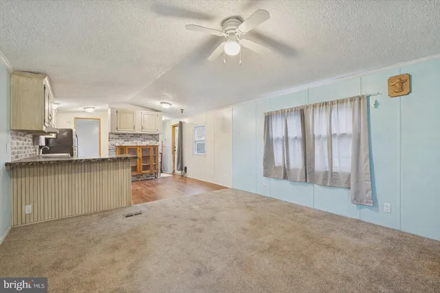 a view of a kitchen with a sink and cabinet area