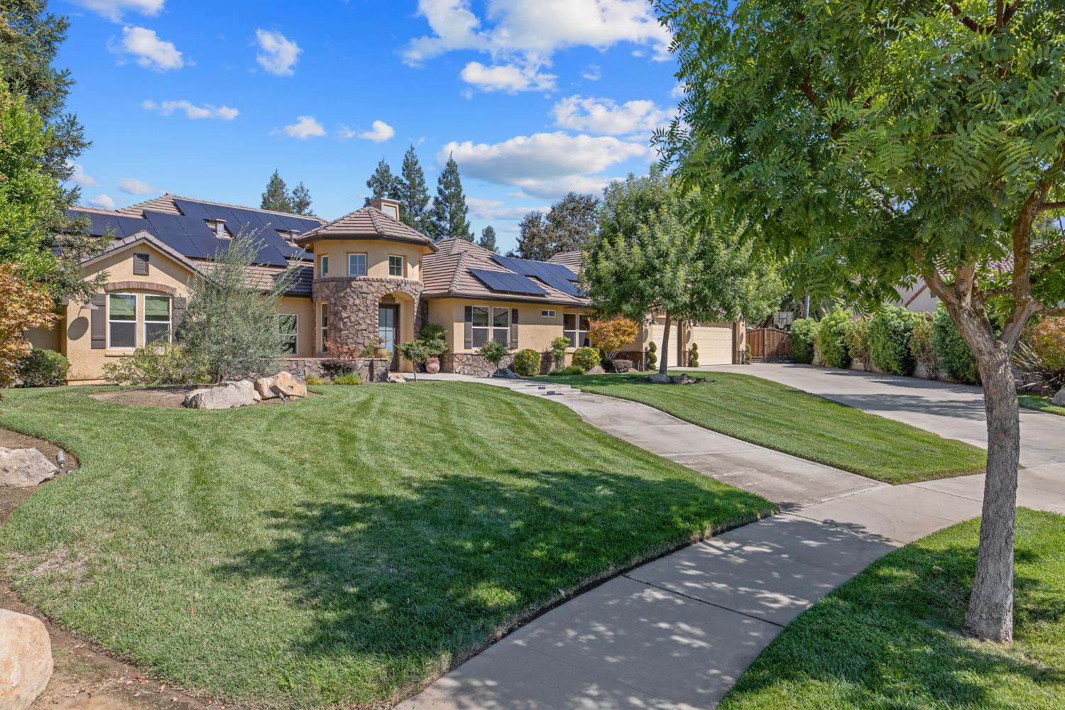 1548 North Rova Street Visalia, CA 93291 - Photo 2 of 9 a front view of a house with a yard
