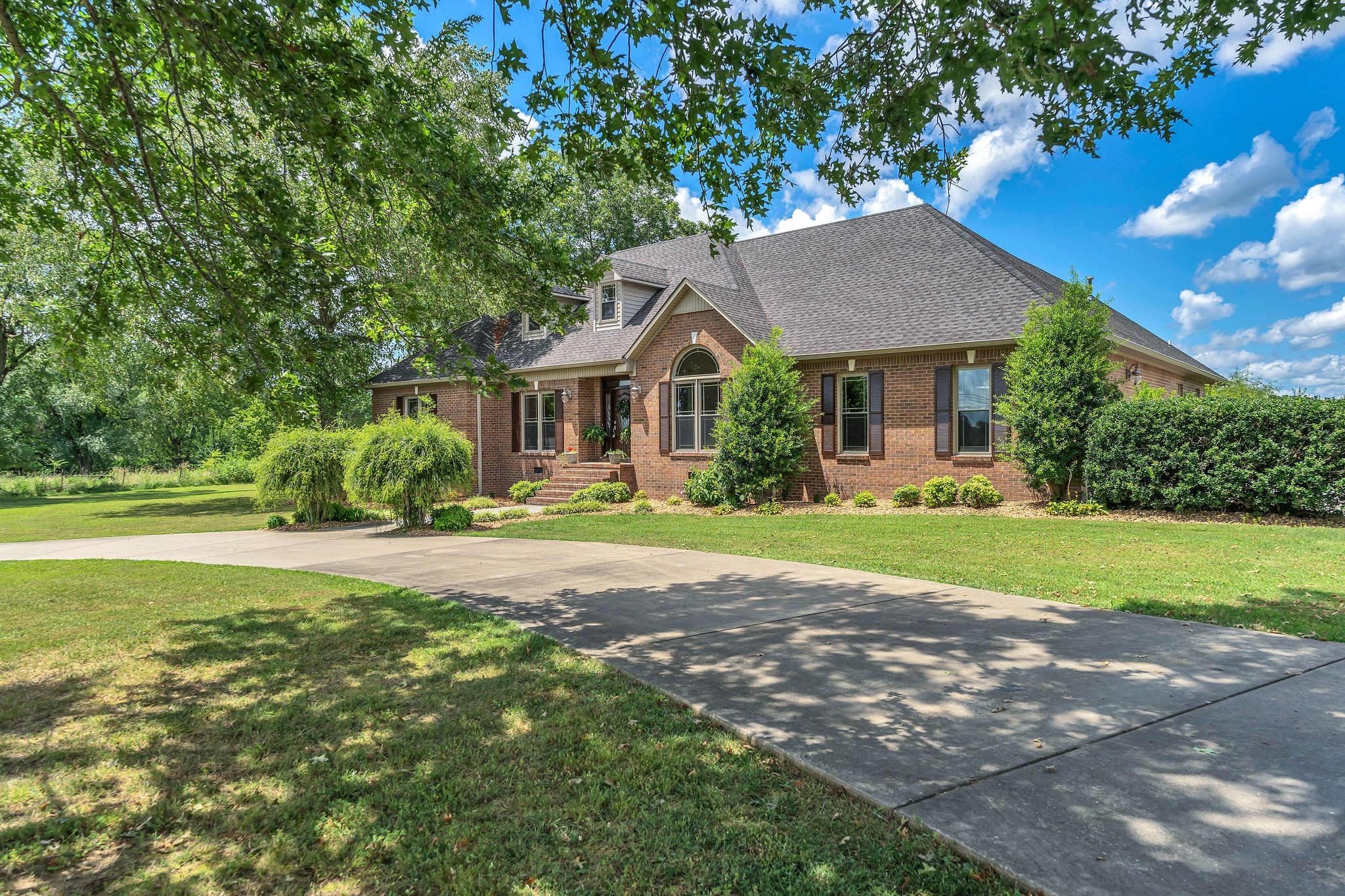 1395 Ragsdale Road Manchester, TN 37355 - Photo 1 of 52 a view of a house with a big yard plants and large trees