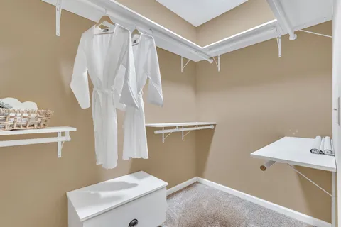 a view of a room with wooden floor and window