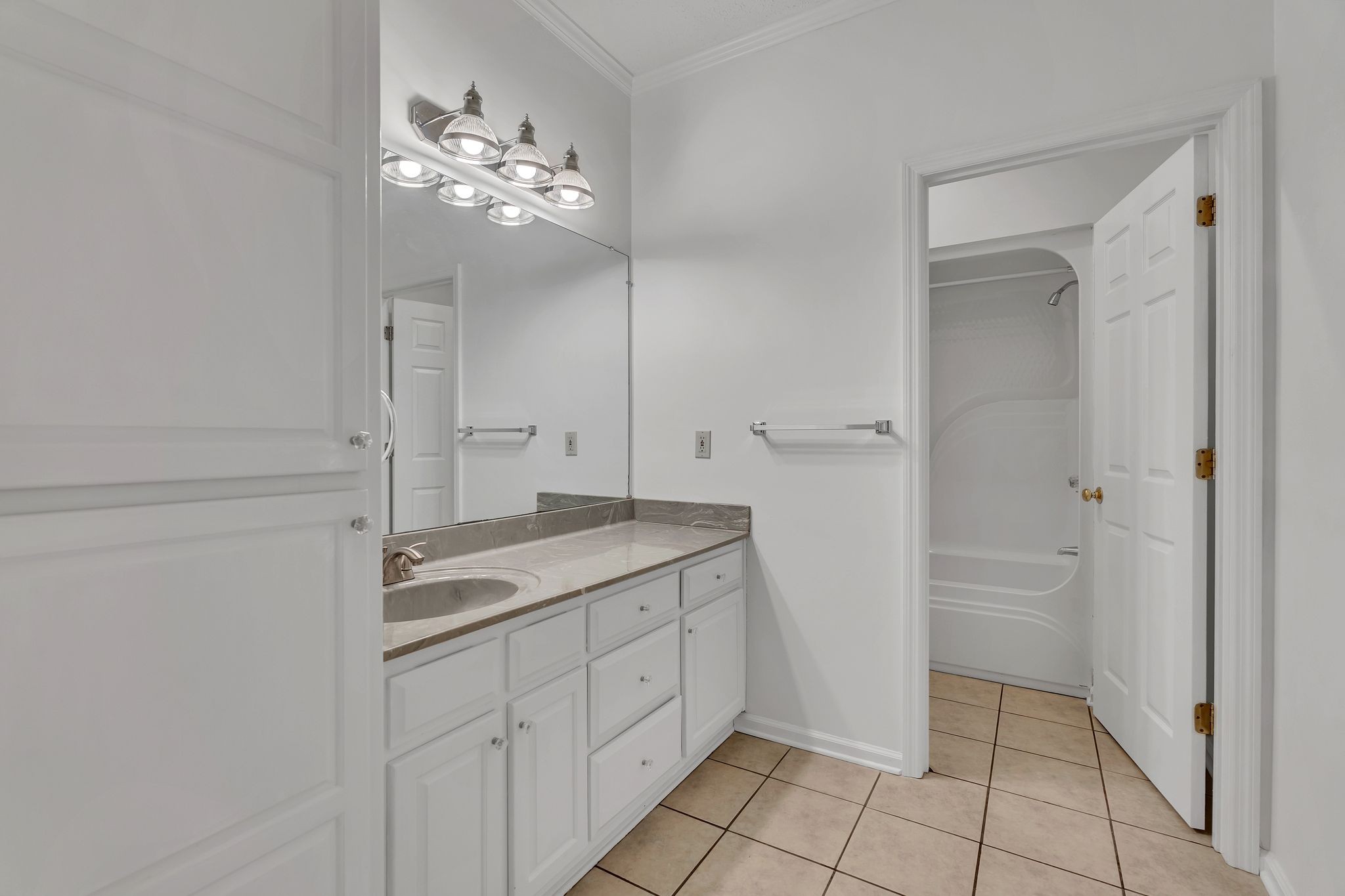 1395 Ragsdale Road Manchester, TN 37355 - Photo 32 of 52 a spacious bathroom with a granite countertop sink a mirror and a vanity