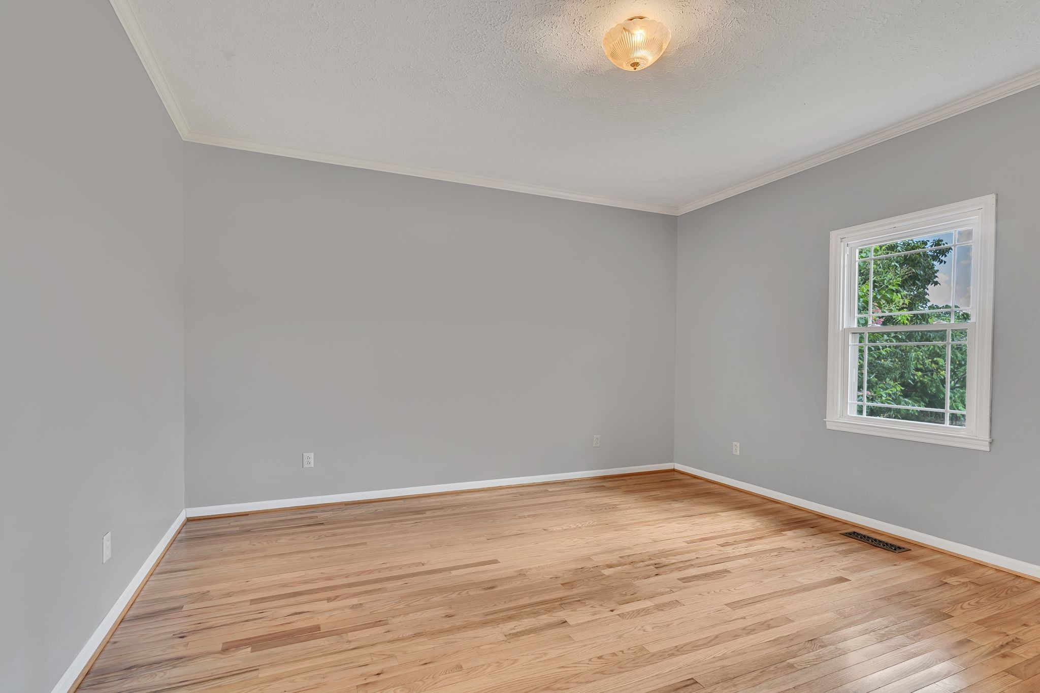 1395 Ragsdale Road Manchester, TN 37355 - Photo 33 of 52 a view of an empty room with wooden floor and a window