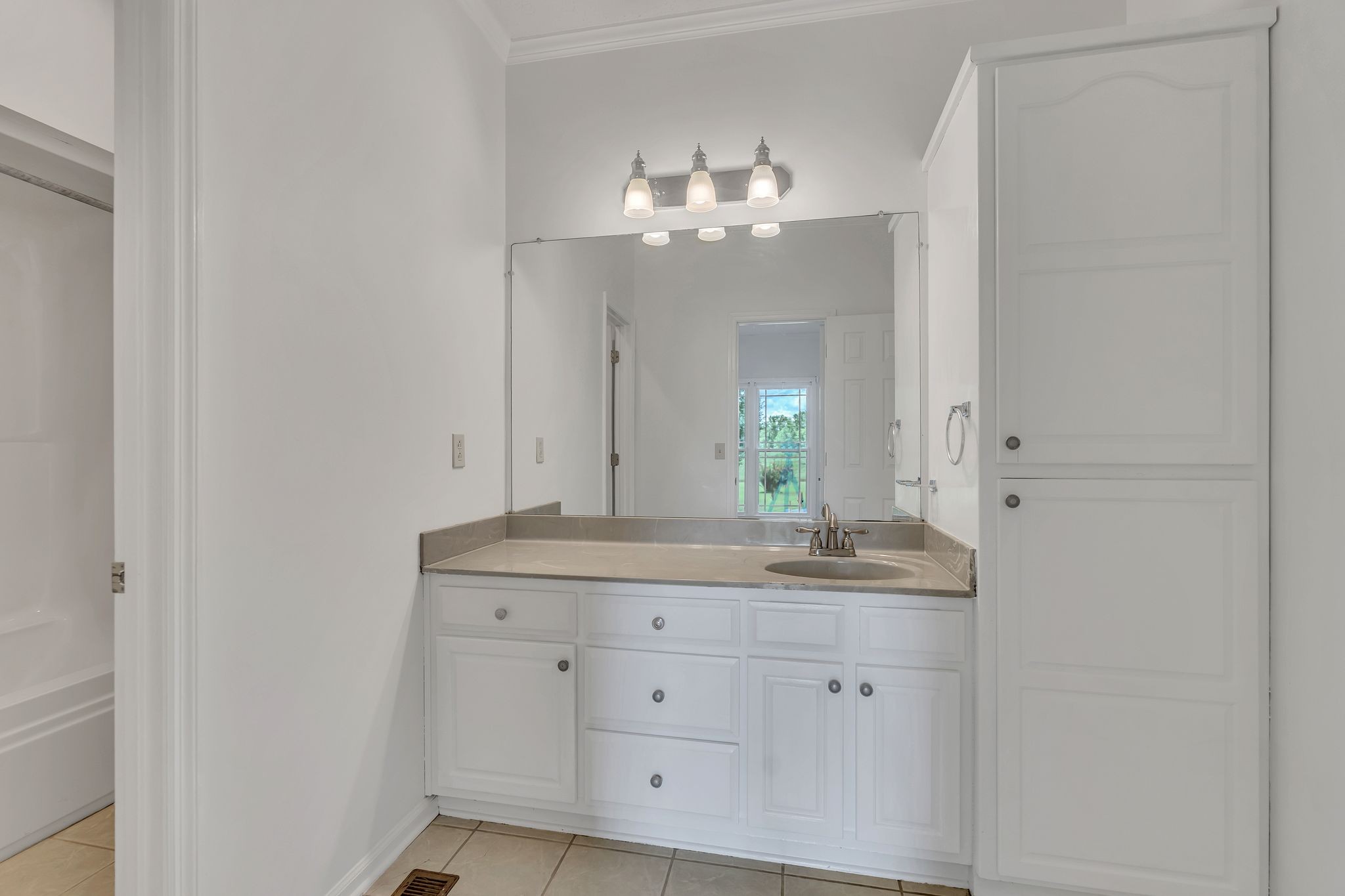 1395 Ragsdale Road Manchester, TN 37355 - Photo 36 of 52 a bathroom with a granite countertop double vanity sink and a mirror