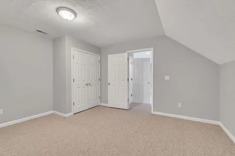 a view of a big yard with lots of green space