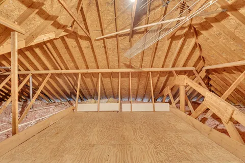 a view of a golf course with yellow lighting