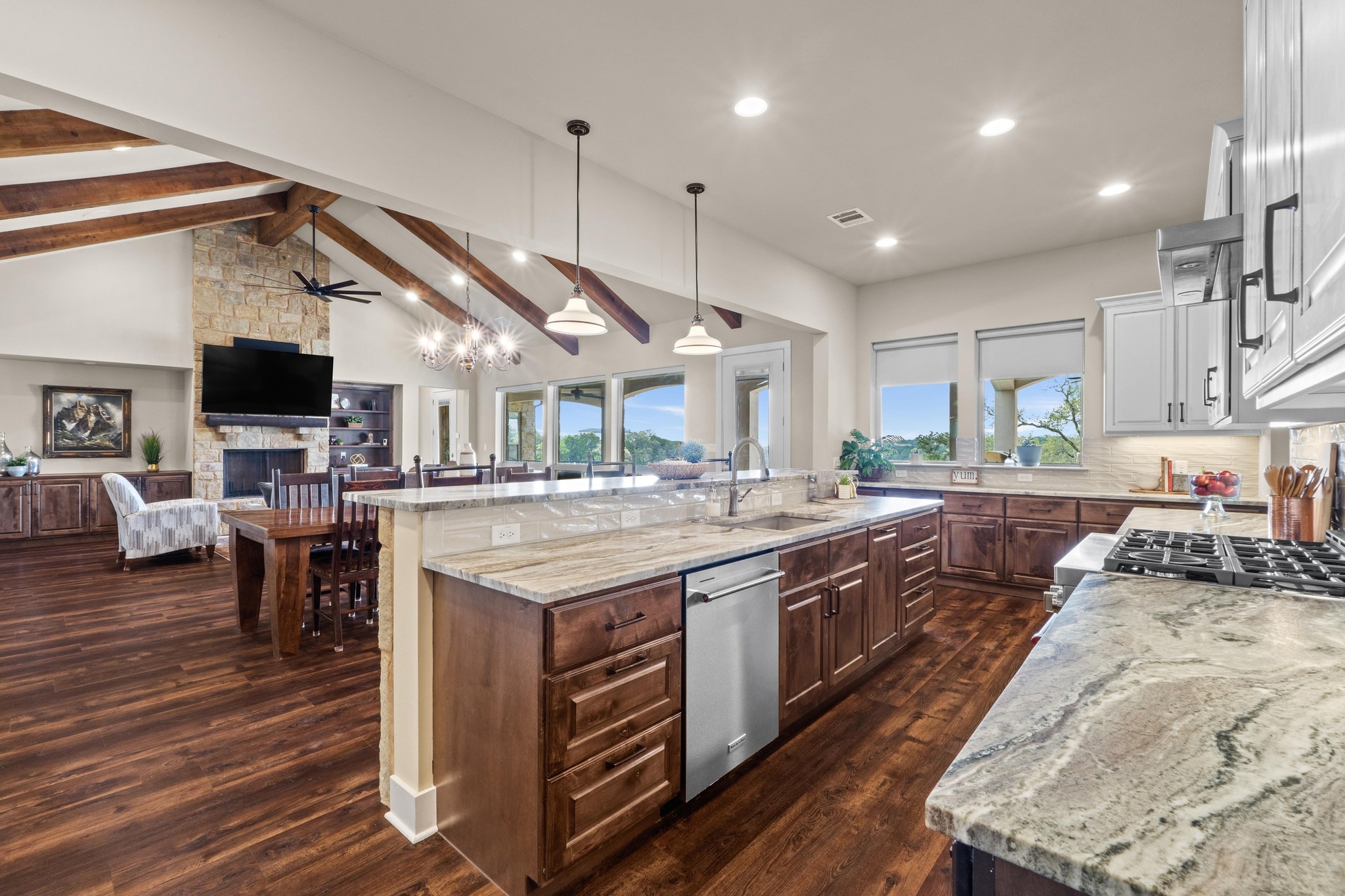 18817 Hidden Ridge Place Jonestown, TX 78645 - Photo 40 of 40 a large kitchen with stainless steel appliances granite countertop a stove and a view of living room