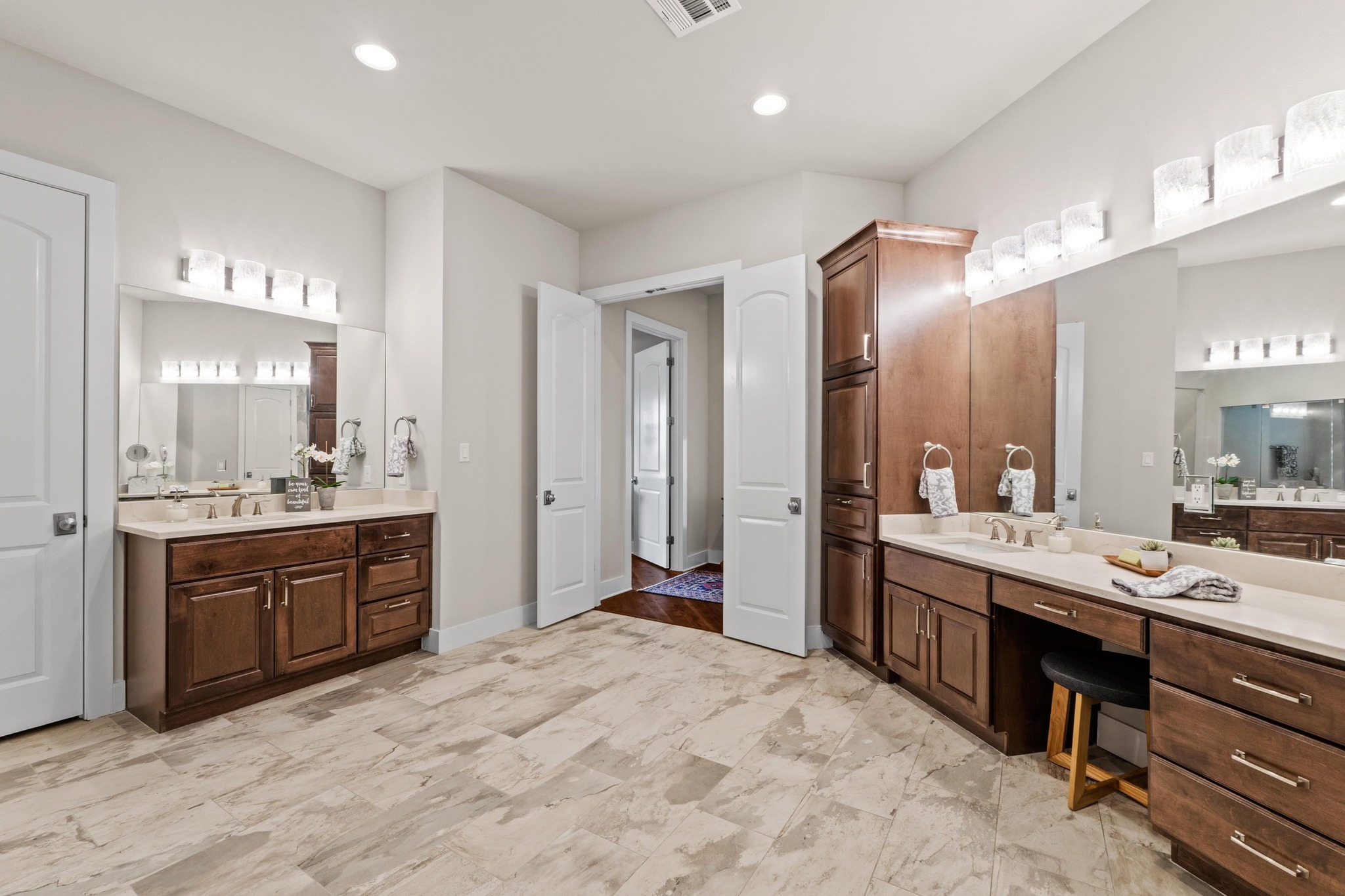 18817 Hidden Ridge Place Jonestown, TX 78645 - Photo 18 of 40 Full bathroom with two vanities, visible vents, and a sink
