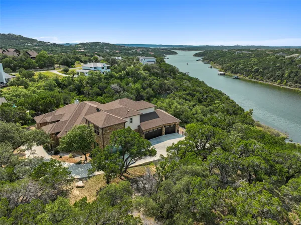 an aerial view of house with ocean view