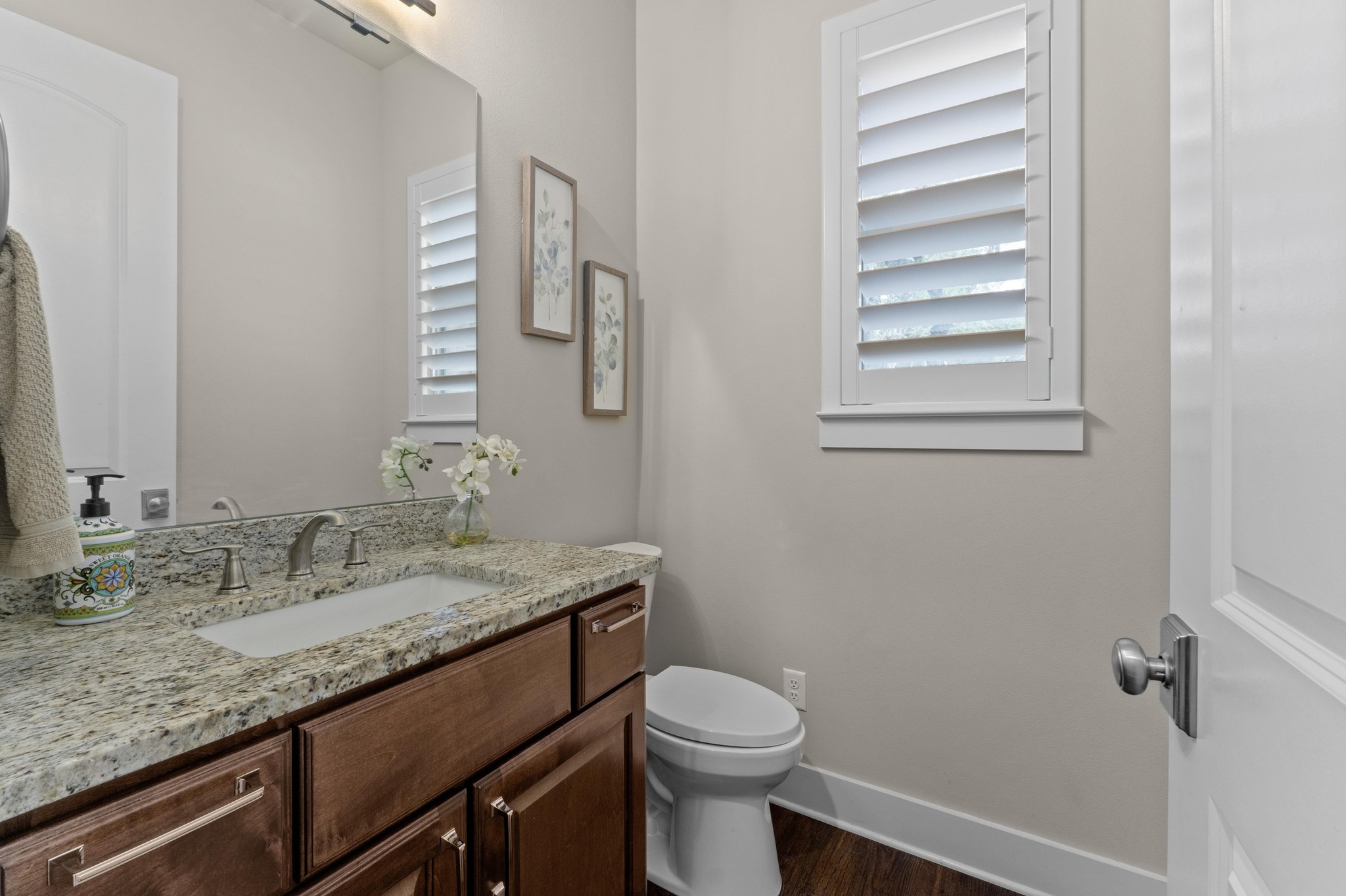 18817 Hidden Ridge Place Jonestown, TX 78645 - Photo 23 of 40 a bathroom with a granite countertop sink toilet and mirror